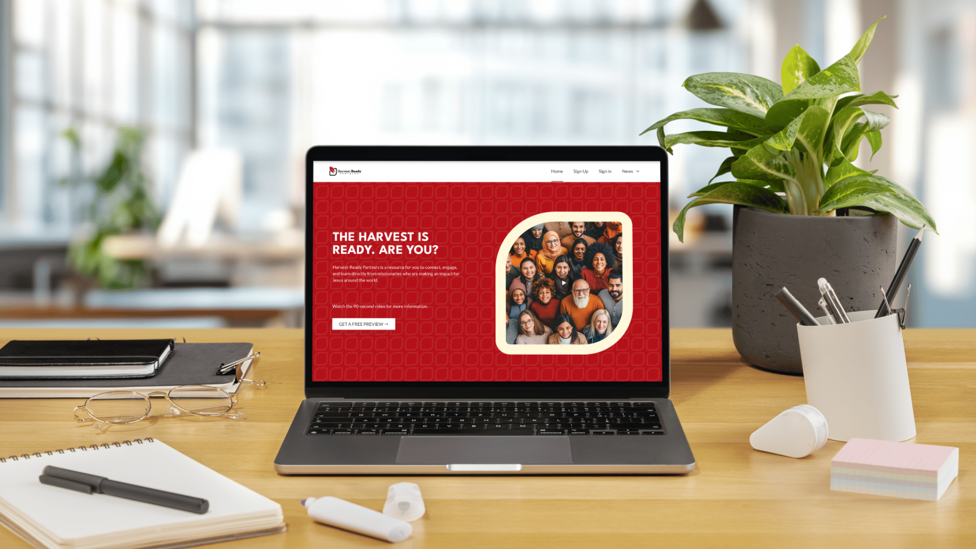 A laptop on a desk displaying the Harvest Ready Partners website