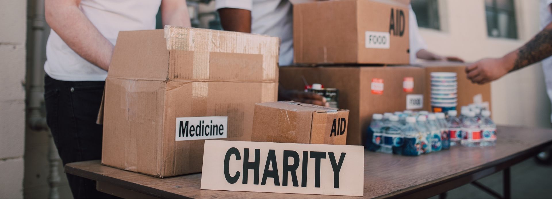 Charity donation boxes with food, medicine, and aid supplies