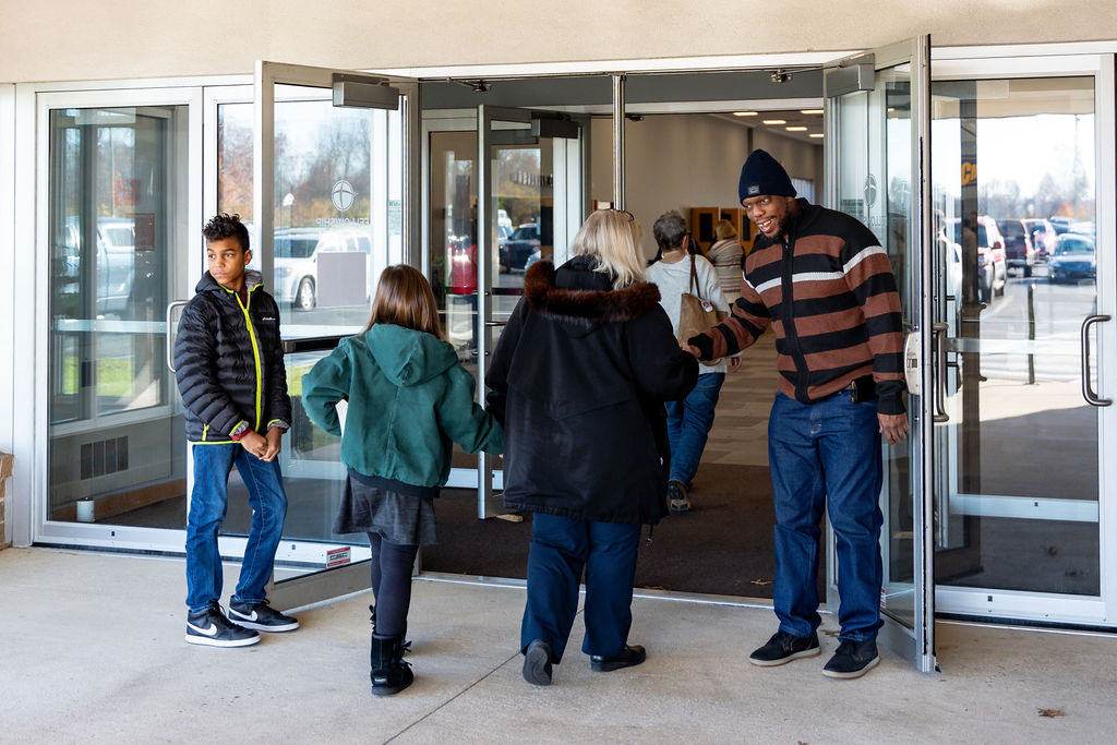 People being welcomed into Fellowship Missionary Church